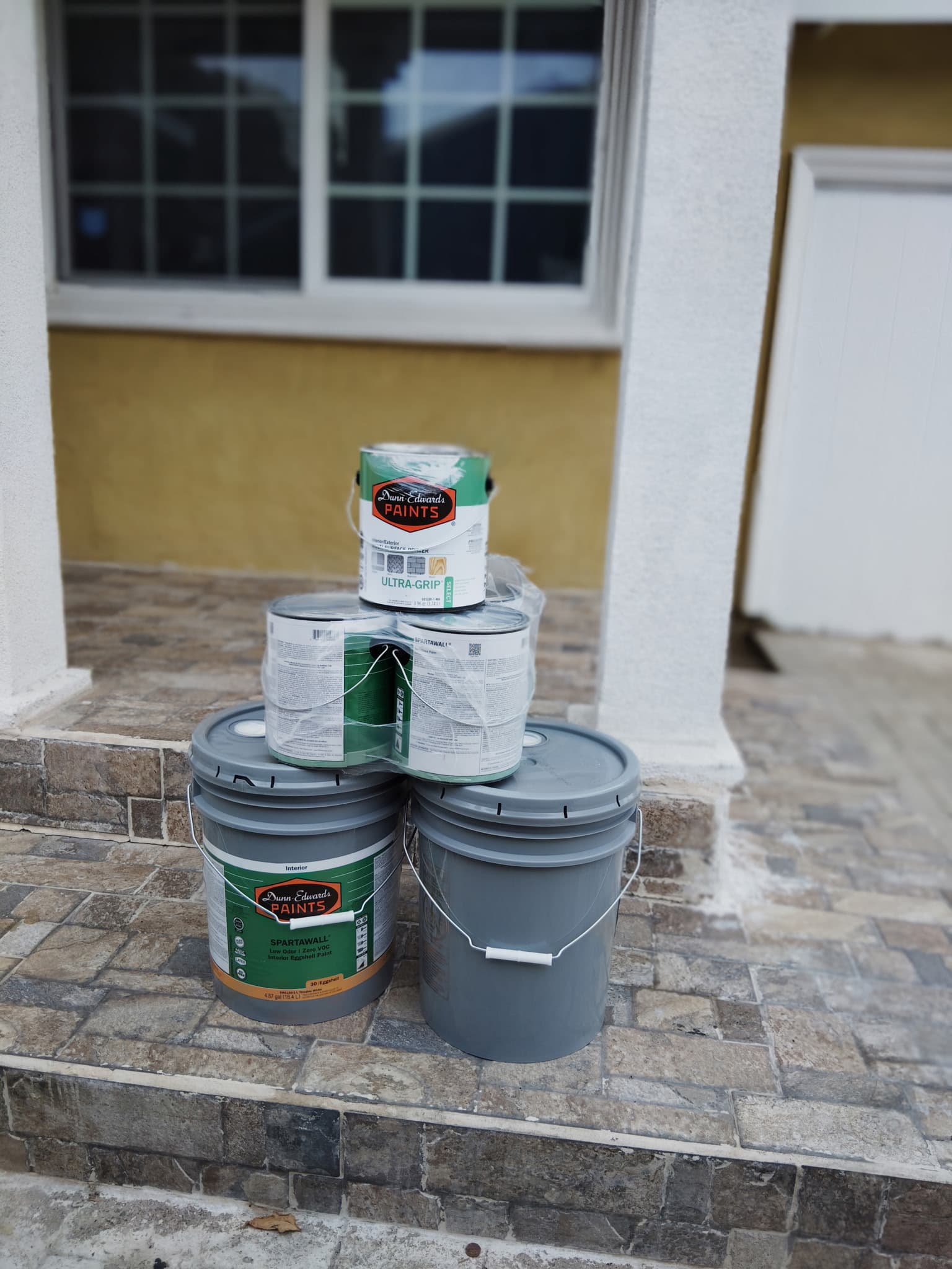 Professional painter prepping a home interior for painting